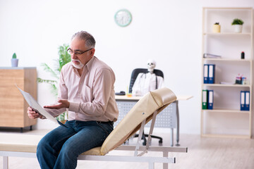 Old man visiting dead doctor radiologist