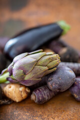 Artichoke and purple vegetables from the autumn harvest.