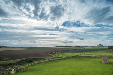 Scenic view of green field with blue sky