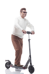 Fototapeta na wymiar in full growth. casual adult male with electric scooter.