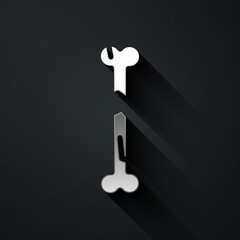 Silver Human broken bone icon isolated on black background. Long shadow style. Vector.