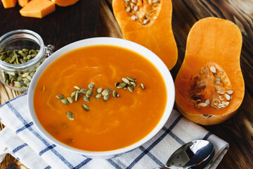 Close up photo of pureed pumpkin soup with pumpkin seeds