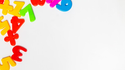 Colorful plastic numberson white background with copy space