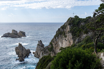 Corfu Greece island Christian cross on mountain top overlooking ocean religious symbol near monastery  in Paleokastritsa