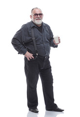 Fototapeta premium full- length . a successful older man drinks takeaway coffee