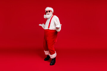 Fototapeta na wymiar Full length body size view of his he handsome cheerful cheery glad bearded Santa hipster dancing having fun rest chill out December isolated bright vivid shine vibrant red color background