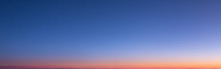 Fototapeta premium Dramatic colorful sky with afterglow and illuminated clouds