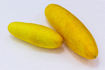Big yellow cucumber on White background
