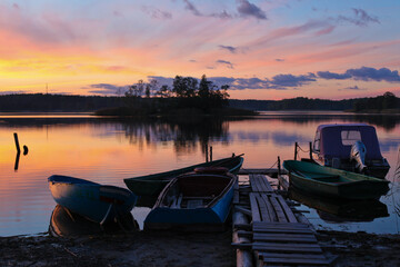 Obraz premium Sunset boats on water