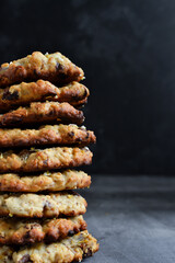 Oatmeal cookies. Homemade baking. cookies with dried apricots and chocolate. Copy space. Isolated on Dark background.