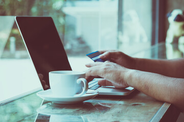 Male customer order goods from internet shopping and pay by credit card