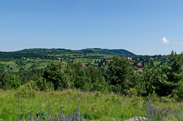 Summer panoramic view of the neighborhoods of the village of Plana in the mountain Plana, Bulgaria  