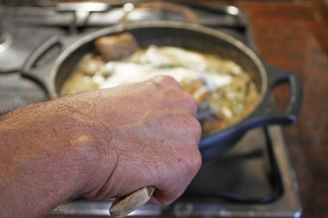 Cooking meat in a pan