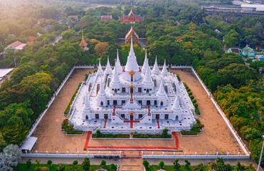 White Buddhist Pagoda with multiple spires at Wat Asokaram Temple in Samutprakan province, Thailand
