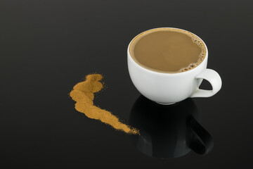 Instant coffee in a white cup on a black glass background, reflection