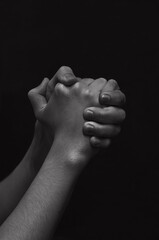 Fototapeta premium men's hands on a dark background close-up