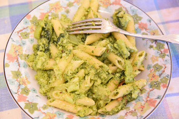 Italian Penne With Vegetables in the plate With Fork