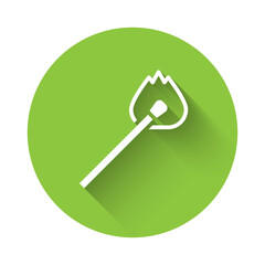 White Burning match with fire icon isolated with long shadow. Match with fire. Matches sign. Green circle button. Vector.