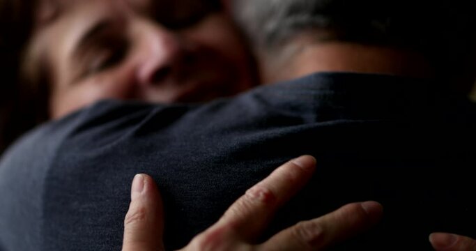 Empathic hug and support close-up senior woman embracing person