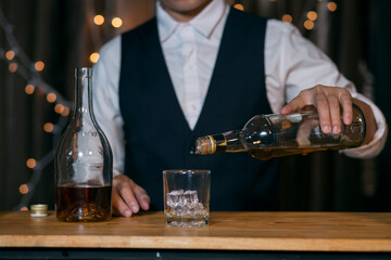 Barman pouring whiskey whiskey glass beautiful night