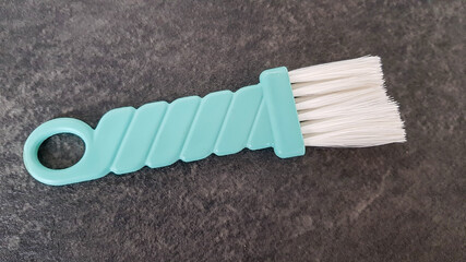 The cooking brush used in cooking for greasing lies on a dark background