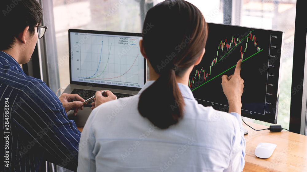 Poster broker showing some ascending to his colleague planning and analyzing graph stock market trading wit