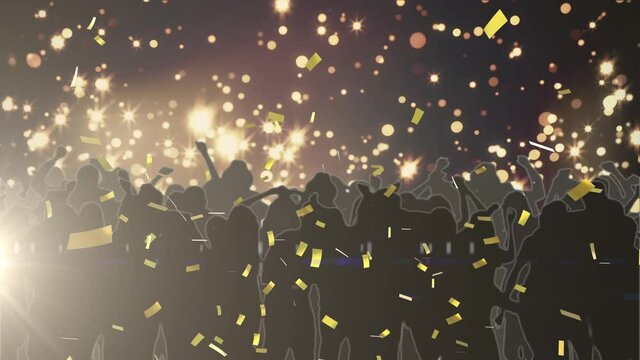 Glowing spots of lights and confetti falling over silhouettes of people dancing