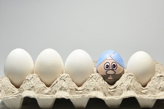 Illustrated egg with Indian Punjabi male face