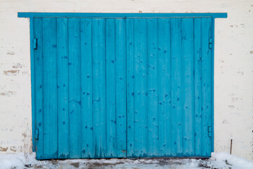 Naklejka na ściany i meble Blue gates made of wooden planks. Background. Copy space.