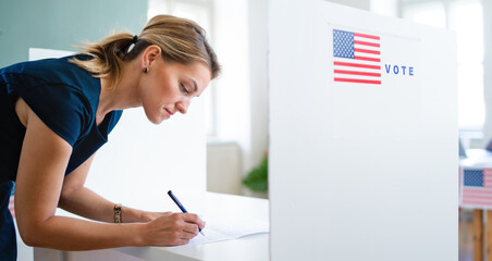 Portrait of woman voter in polling place, usa elections concept.