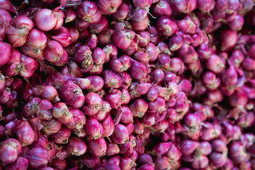 red onions on marker shelf background