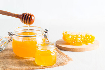 honey dipper and honeycomb. nuts and apples with honey and nuts of various kinds