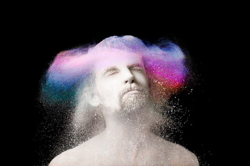 portrait of a guy in white and colored powder