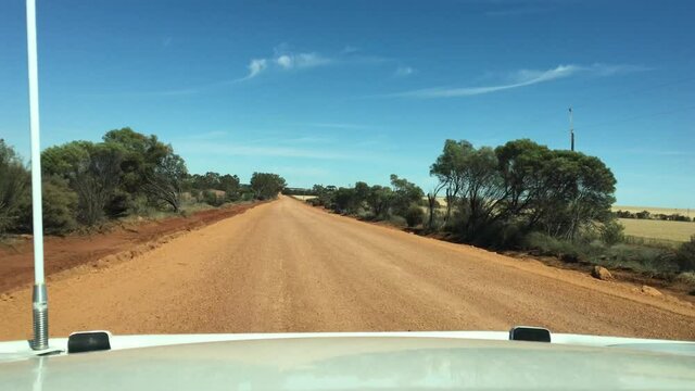 Point of view of a vehicle driving along the wheat belt of Western Australia