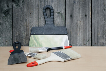 Tool for painting work. Spatula and brushes. Set of items for repair. Top view of a builder with a...