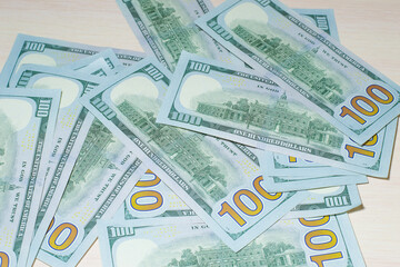 One hundred US dollars banknotes, background, 100 us dollars,cash paper money, top view, Wallpaper, financial concept, economy.