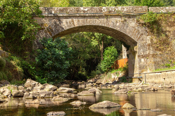 old bridge over the bubal river in os peares, ourense, galicia, spain