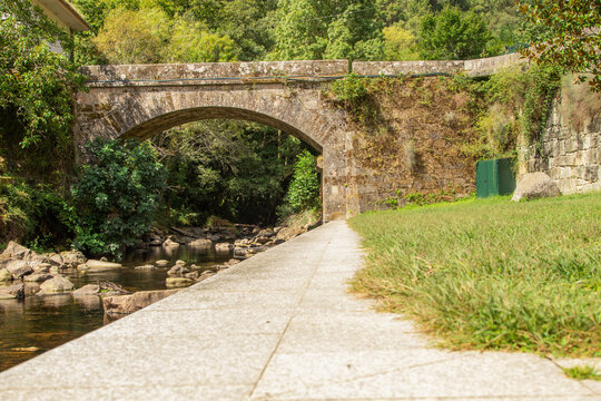 old bridge over the bubal river in os peares, ourense, galicia, spain