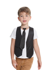 Little cute boy in a vest and tie isolated on a white background.