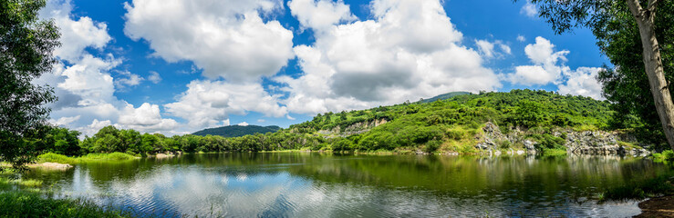 Naklejka na ściany i meble Nature landscape of Ba Be lake ( another name is Nui Da lake, May Nui lake ) in Ma Thien Lanh valley, Ba Den mountain, Tay Ninh province, Vietnam.
