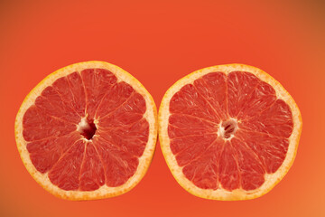 Two halves of grapefruit in the background
