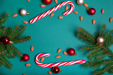 Christmas background. Spruce branches, Christmas toys, sweets.
