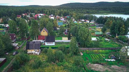 Obraz na płótnie Canvas Aerial Townscape of Suburban Village Fedoseevka located in Kandalaksha Area in Northwestern Russia on the Kola Peninsula