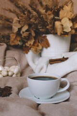 Obraz na płótnie Canvas Coffee cup on a blanket