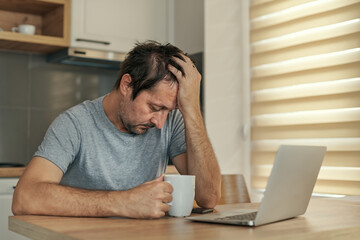 Disappointed freelancer at home office having job problems