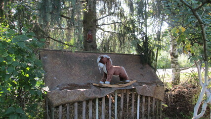Old Toy Horse Under The Tree