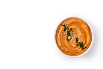 Pumpkin hummus in bow isolated on white background .Top view. Copy space