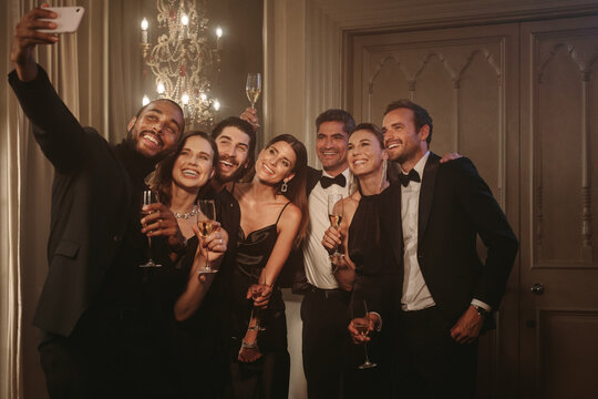 Man taking selfie with his friends at celebration party