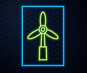 Glowing neon line Wind turbine icon isolated on brick wall background. Wind generator sign. Windmill for electric power production. Vector.