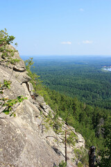 Fototapeta na wymiar View of the Siberian taiga from the stone ridge